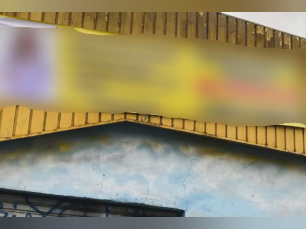 Placa colocada na porta de oficina mecânica chama atenção de motoristas