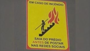 Placa chama atenção com alerta em caso de incêndio