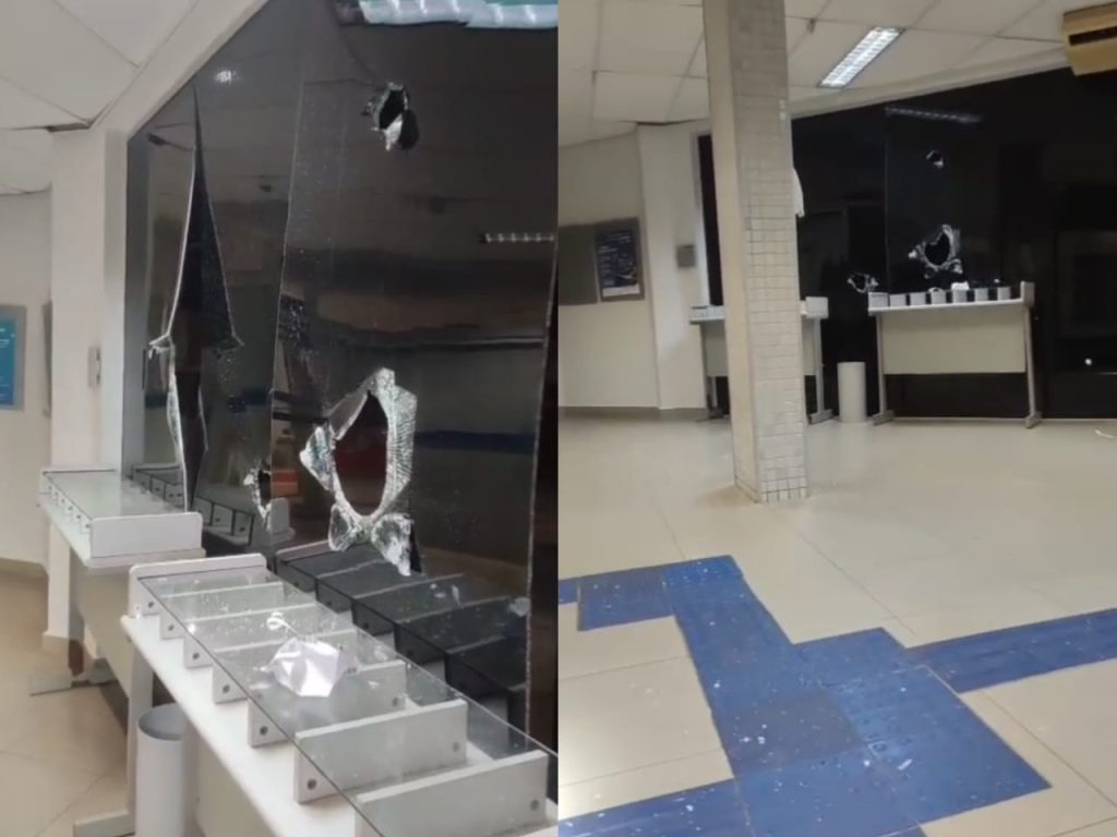 Danos na estrutura da agência pelo ato de vandalismo foram registrados em vídeo. (Foto: Reprodução)