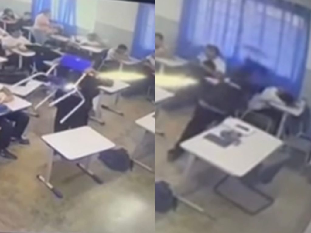 Filmagem mostra momento em que adolescente dá a cadeirada no colega, que estava deitado na carteira. (Foto: Reprodução)