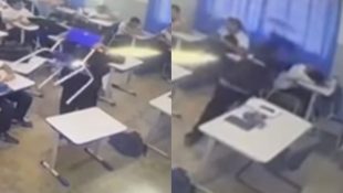 Filmagem mostra momento em que adolescente dá a cadeirada no colega, que estava deitado na carteira. (Foto: Reprodução)