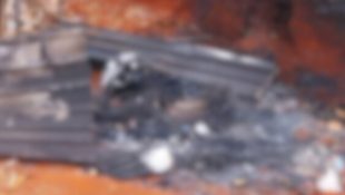 Corpo foi encontrado carbonizado em um campo aberto.