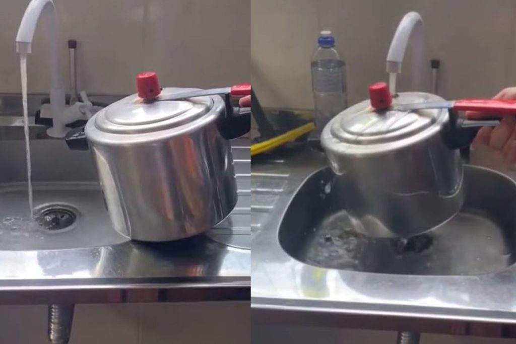 Panela de pressão embaixo da torneira