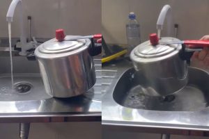 Panela de pressão embaixo da torneira