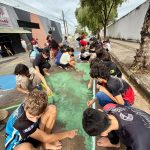 Alunos de colégio de Anápolis resgatam tradição e pintam rua para a Copa do Mundo