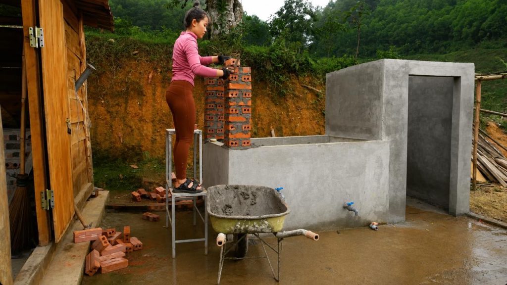 jovem constrói casa na selva